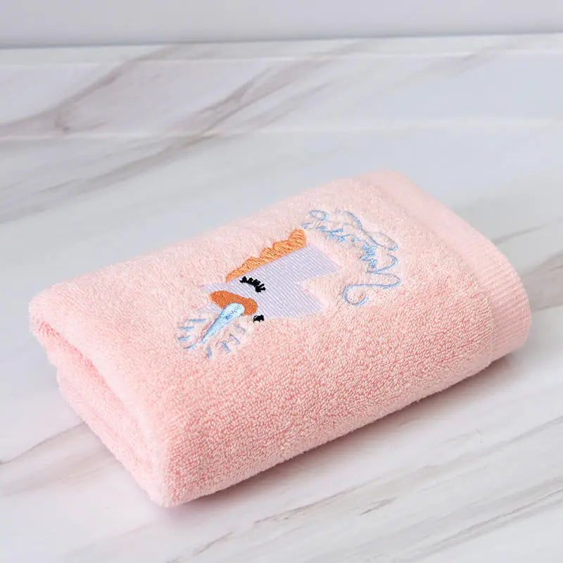 Pink cotton towel with embroidered unicorn motif