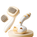 Snagly Cat Groom and Shine self-cleaning comb on pure white background, square ecommerce packshot
