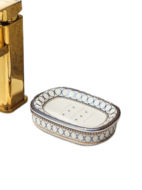 Striped ceramic soap dish product shot on clean white background