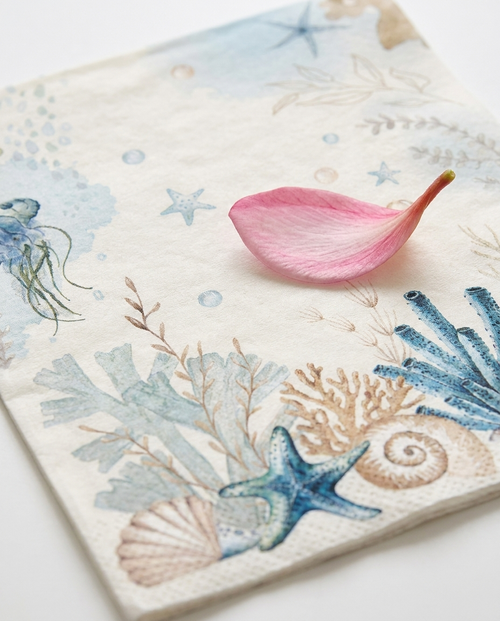 Close-up of tropical paper napkin showing colorful print and 2-ply soft texture