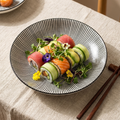7-Inch Eastern Chic Ceramic Plate with blue stripe pattern plated with sushi on a styled linen table
