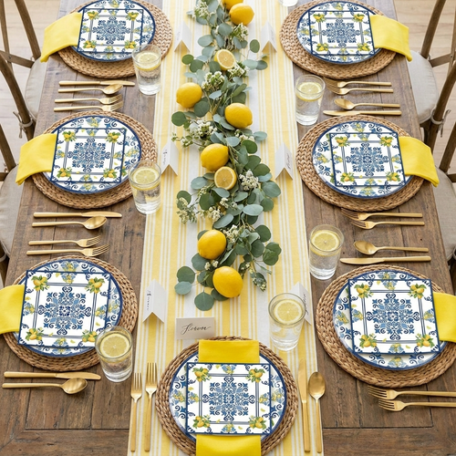 40-piece lemon birthday party tableware set styled as elegant summer citrus tablescape with lemon plates, yellow napkins, gold cutlery and fresh lemon accents