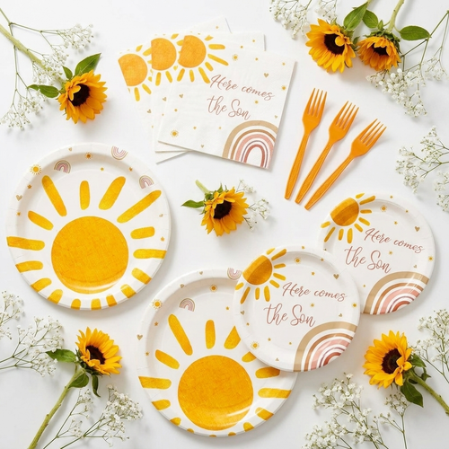 Flat-lay of sun baby shower party tableware pieces — yellow paper plates, napkins and plastic forks arranged with sunflower accents